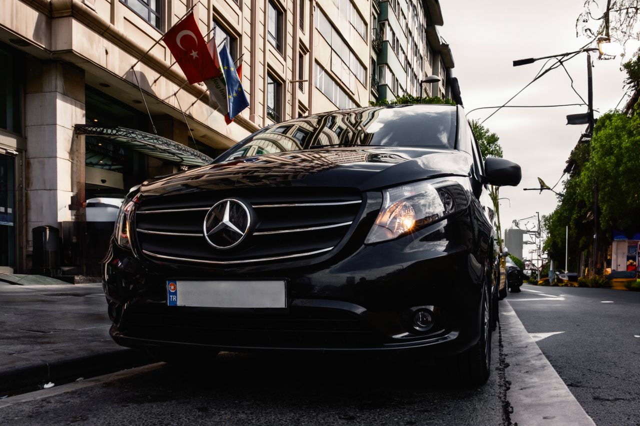 Luxury black Mercedes-Benz Vito parked on a Turkish city street, capturing urban elegance.